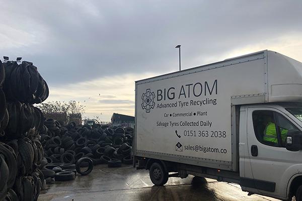 One of Big Atom's white vans collecting waste tyres from a recycling yard