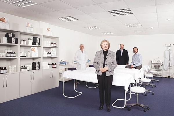 Eve Taylor and her three sons in one of their beauty product labs