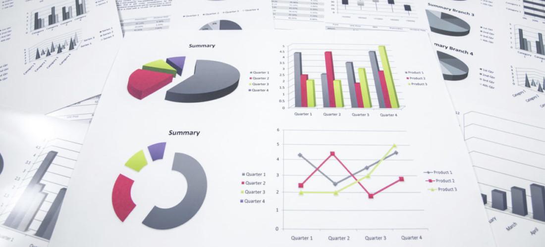 A variety of charts and graphs on pieces of paper