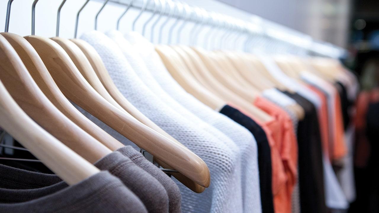 Assortment of clothes hanging on coat hangers