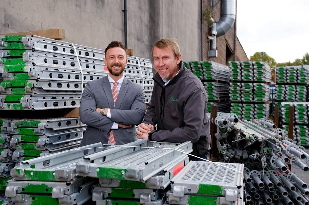 2 men from Rose Scaffolding stood in between scaffolding equipment