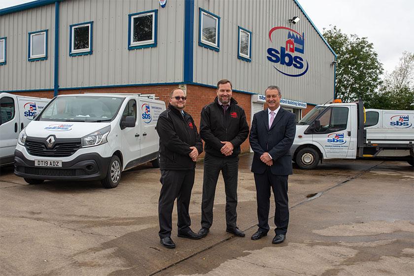 Three men stood outside the Sleaford Building Services office