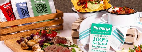 A selection of Thornley's recipe mixes, a plate of vegetables and a bowl of nachos