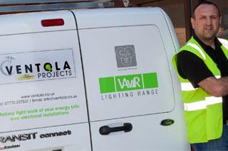 Man in a Hi Vis vest standing next to a Ventola Projects van