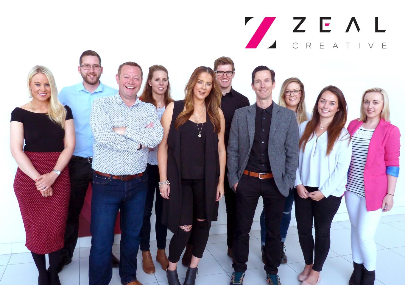 A group of employees from Zeal Creative smiling
