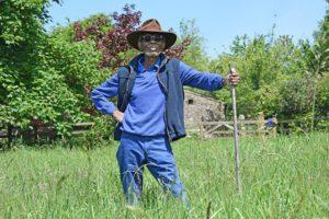 Wilfred Emmanuel-Jones, founder of the Black Farmer brand of food products, standing in a field on his farm