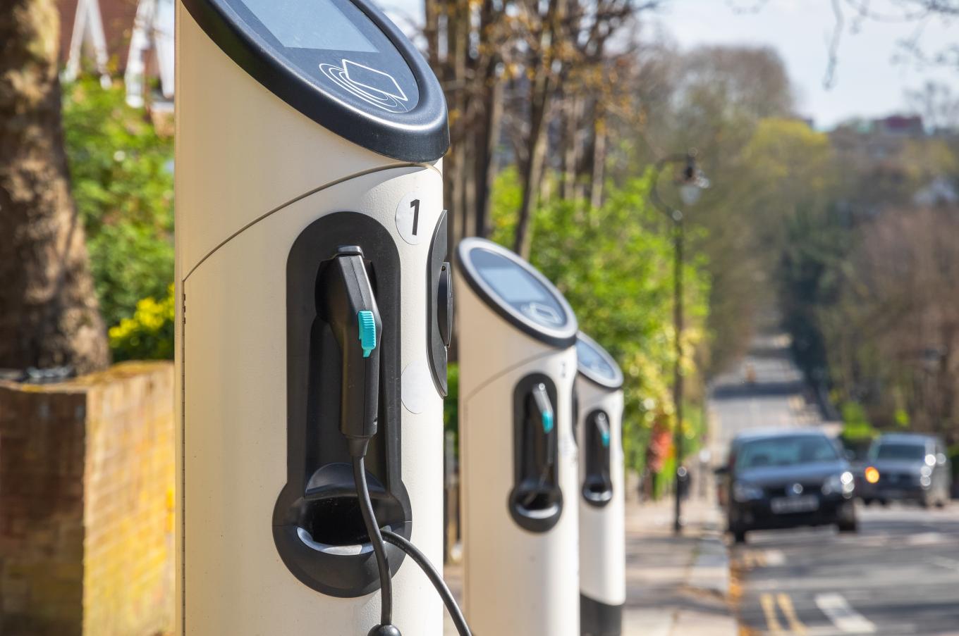 Car charging points on a surburban road