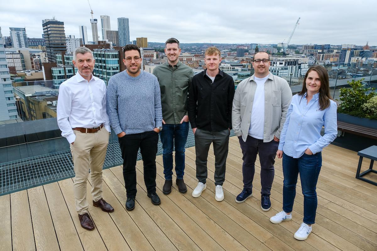 Group of 6 people standing together 
