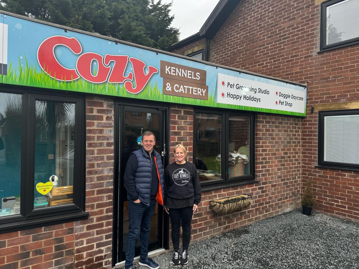 Portrait of the team from Cozy Kennels outside their building in Blackpool