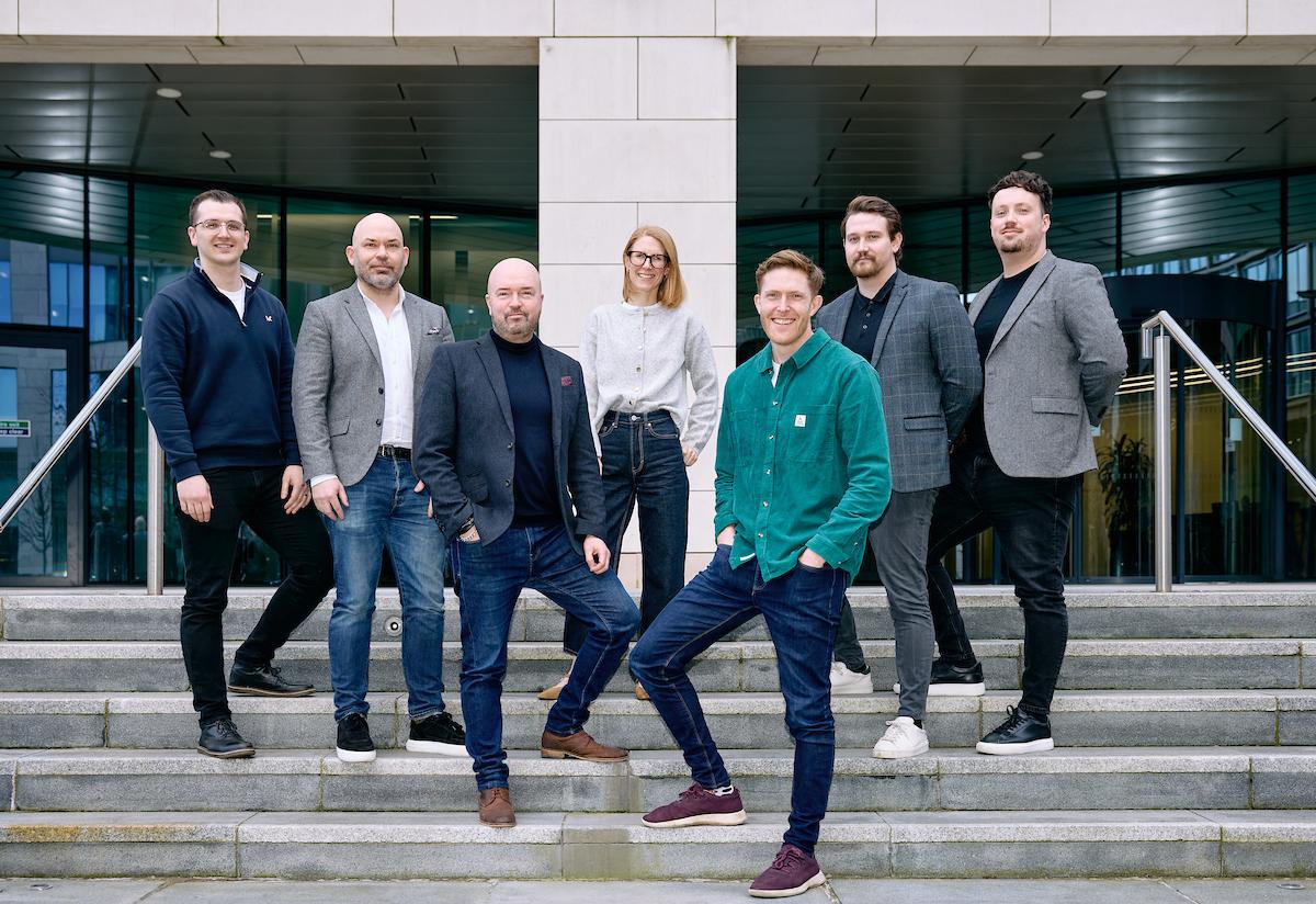 Paul Inman of 75Media front left and Chris Borrett of Mercia Ventures front right with the 75Media team