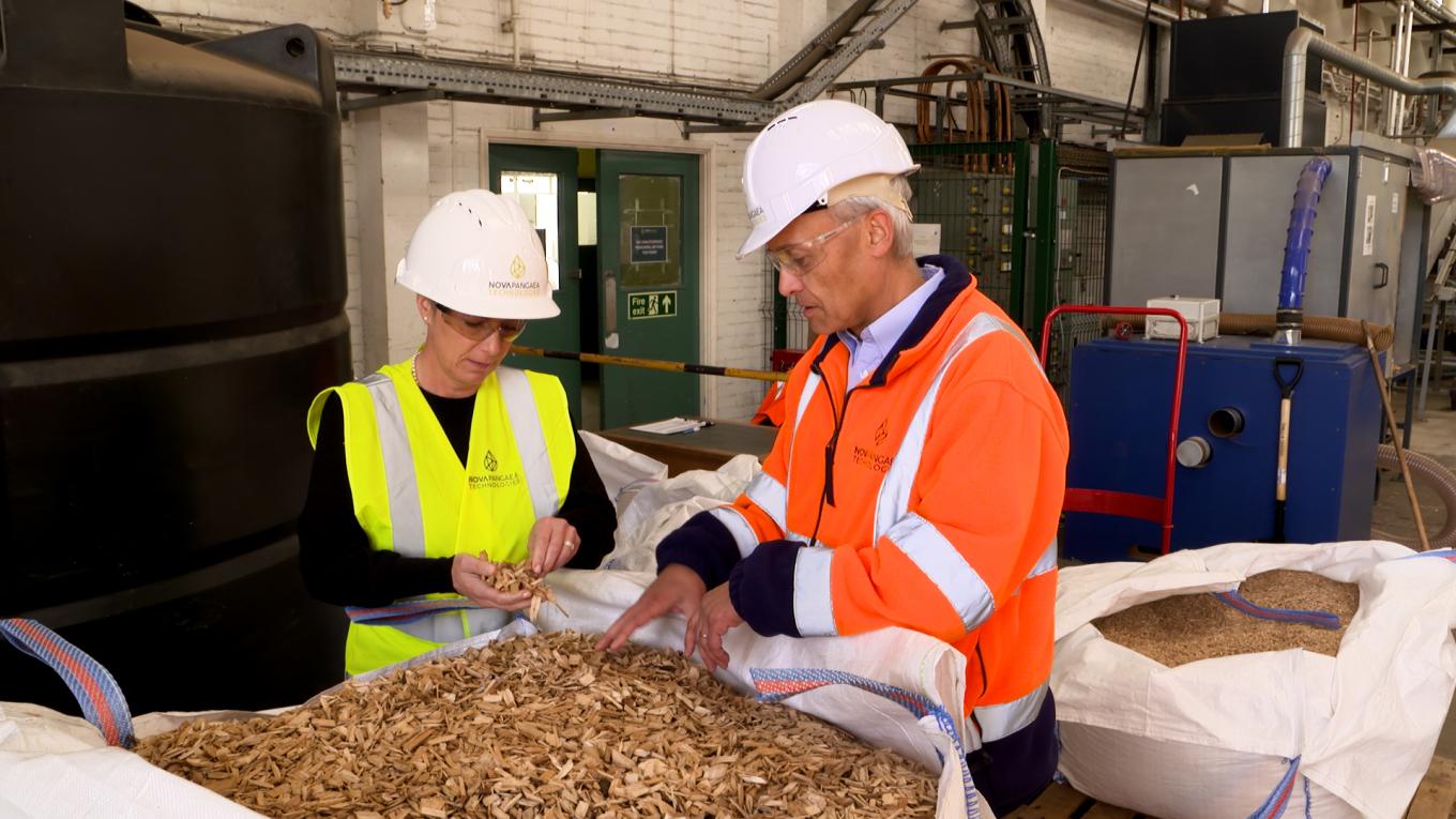 Two men in high-vis and safety hats/goggles