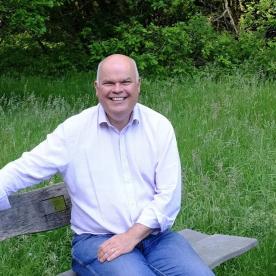Warren Ralls sitting on a bench