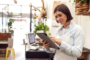 Female business owner using tablet