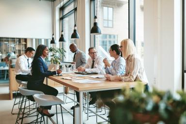 Employees meeting around a table