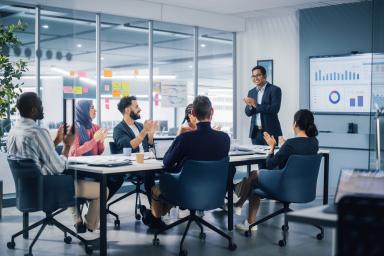 Colleague giving a presentation at a team meeting