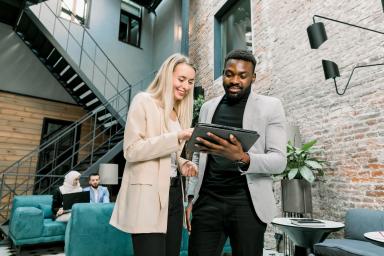 Man and woman looking at tablet computer